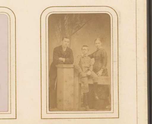 Portrait of a Man, a Woman, and a Boy by a Fence