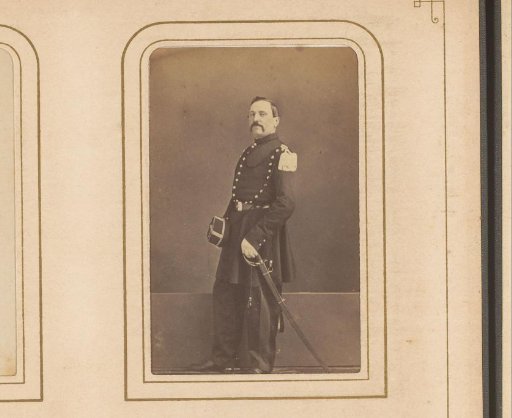 Portrait of a Standing Man in Military Uniform with a Sword
