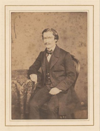 Portrait of a Man with a Mustache, Seated at a Table