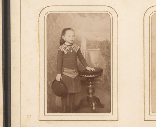 Portrait of a Girl with a Hat in Her Hand, Standing by a Table