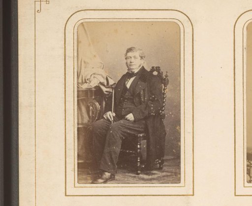 Portrait of a Seated Man Holding a Walking Stick