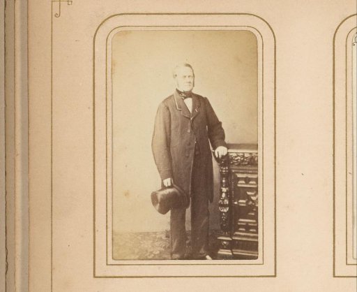 Portrait of a Standing Man with a Top Hat in Hand