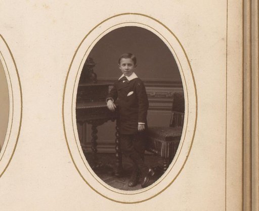 Portrait of a boy leaning on a table