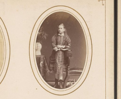 Portrait of a Standing Girl Leaning on the Arm of a Chair