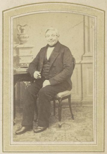 Portrait of a Seated Man at a Table