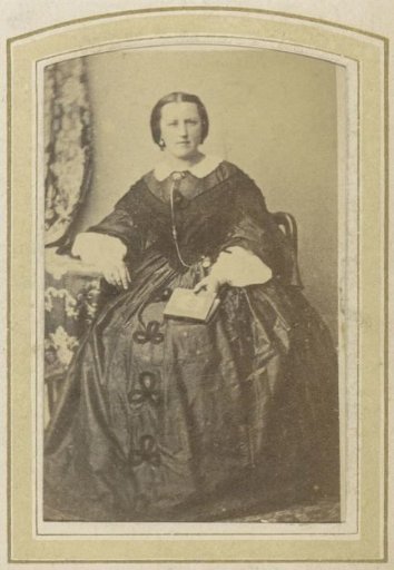 Portrait of a Seated Woman in a Dress Holding a Book
