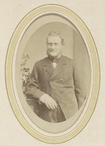 Portrait of a Leaning Man with a Beard and Spectacles