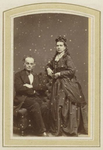 Portrait of a woman in a dress and a seated man