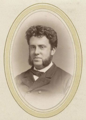 Portrait of a man with sideburns and a bow