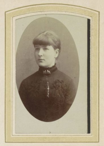 Portrait of a young woman with a brooch
