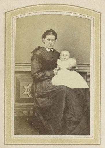 Portrait of a Woman in a Dress with a Baby on Her Lap