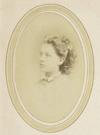 Portrait of a young girl with a bow in her hair