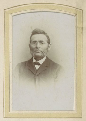 Portrait of a Man with Glasses and Sideburns
