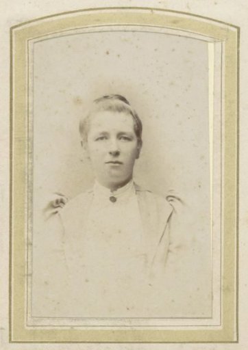Portrait of a Woman with Updo Hair and a Brooch