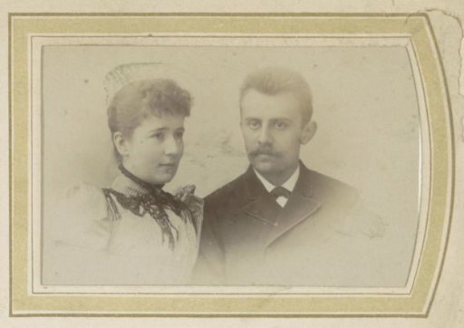 Portrait of a woman in a decorated dress and a man with a mustache and a cravat