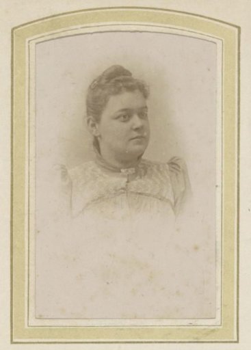 Portrait of a woman with her hair up and a brooch