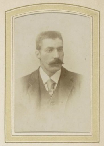Portrait of a man with a mustache, a coat and a cravat