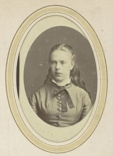 Portrait of a girl with her hair tied back and a ribbon around her neck