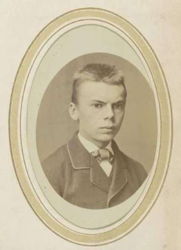 Portrait of a young man in a coat and a cravat