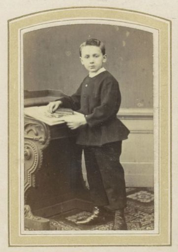 Portrait of a boy at a desk