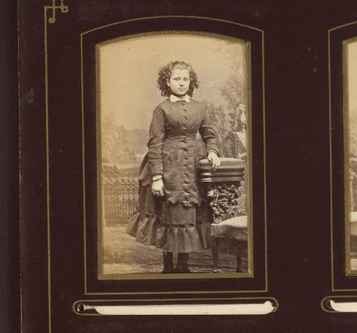 Portrait of a Young Woman Standing by a Chair