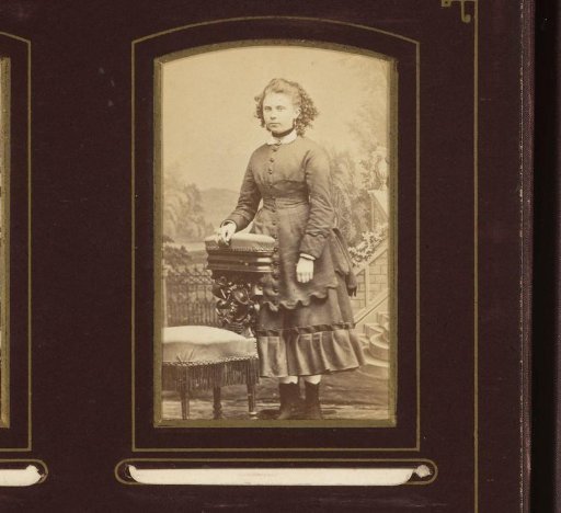 Portrait of a Young Woman Standing by a Chair