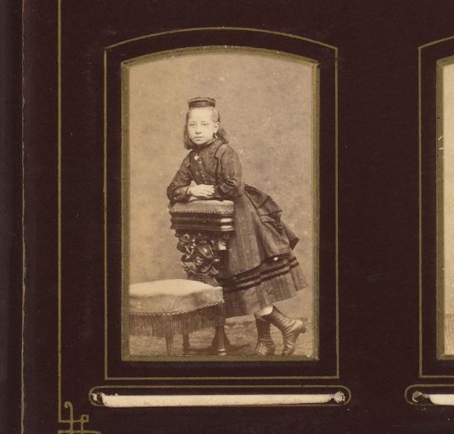 Portrait of a girl, leaning on a prayer stool