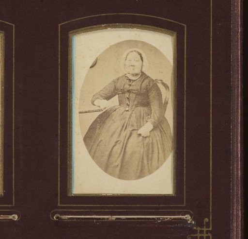 Portrait of a seated woman with cap