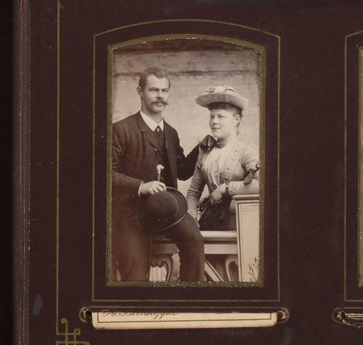 Portrait of a man with hat in hand and a woman at a balustrade