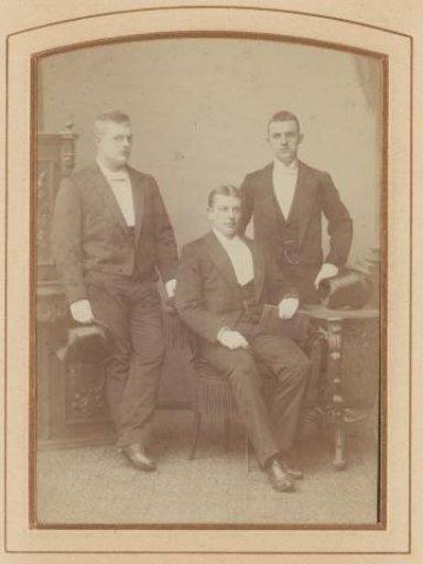 Group portrait with three young men