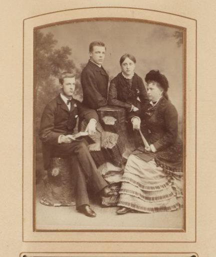 Group portrait with a woman and three young adults