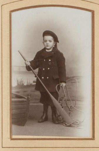 Portrait of a boy with an oar