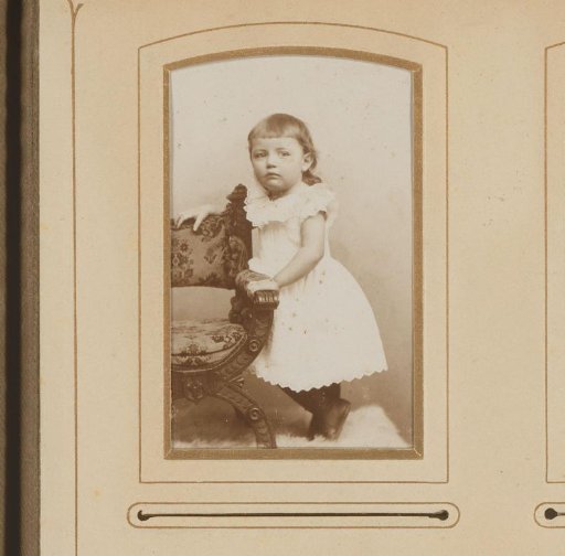 Portrait of a Girl Standing by a Chair