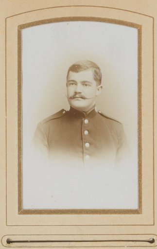 Portrait of a Young Man with a Mustache in Uniform