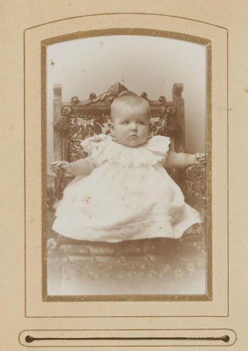 Portrait of a baby, sitting in a chair