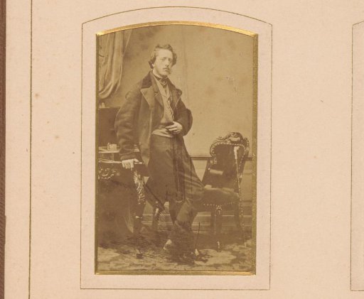 Portrait of a young man at a desk with painter's attributes