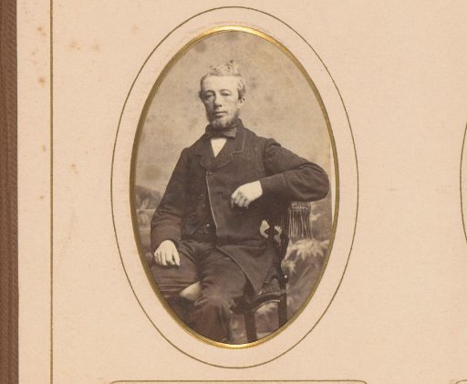 Portrait of a man seated on a chair