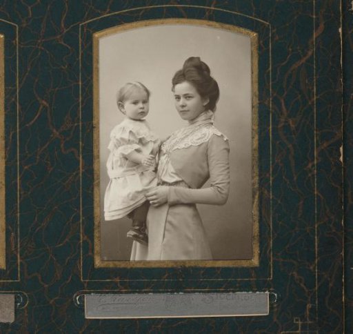 Portrait of a woman with a child in her arms