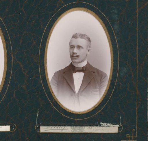 Portrait of a man with a mustache and bow tie