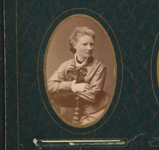 Portrait of a Seated Young Woman Leaning on the Arm of a Chair
