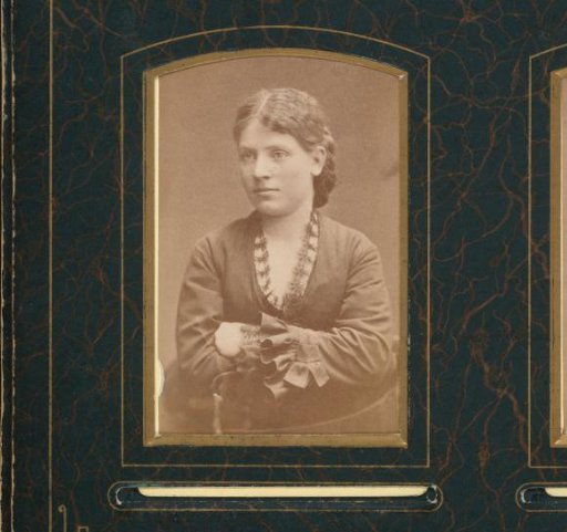 Portrait of a Standing Young Woman Leaning on the Back of a Chair
