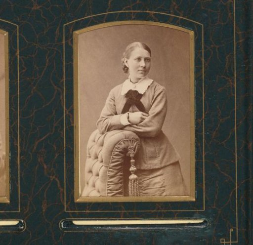 Portrait of a Standing Young Woman Leaning on the Back of a Chair