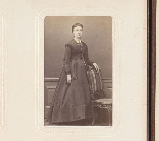 Portrait of a Woman Standing Beside a Chair