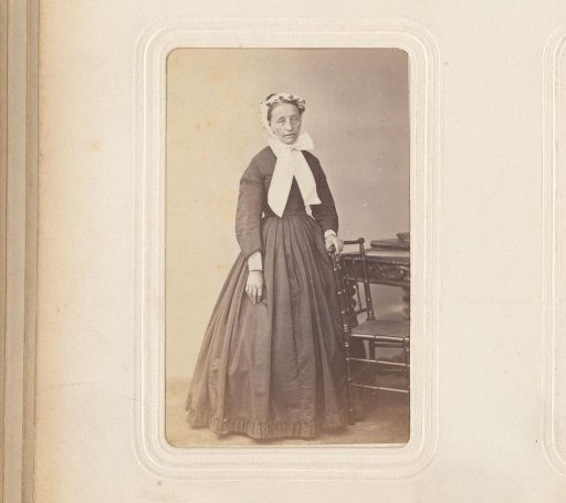 Portrait of a Woman Standing Beside a Chair