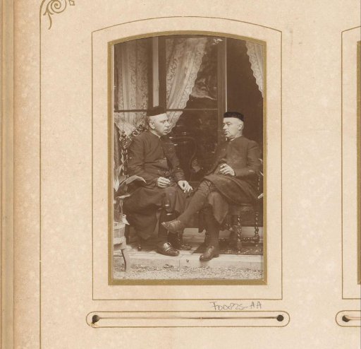 Portrait of two clergymen, seated on a terrace