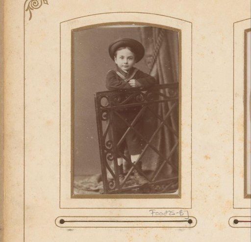 Portrait of a boy leaning on a railing