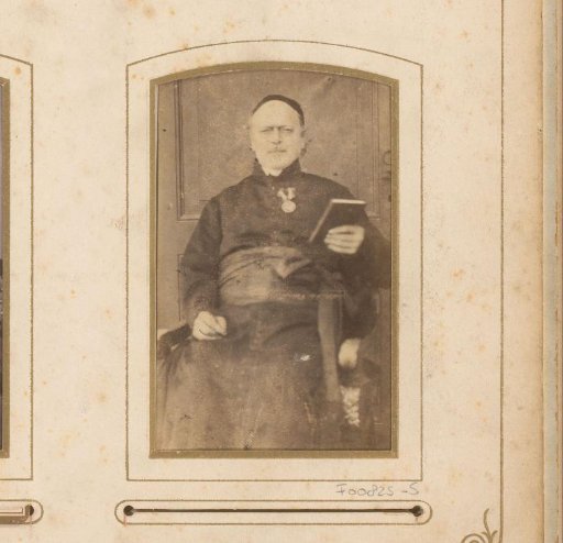 Portrait of a seated man with a book in his hand
