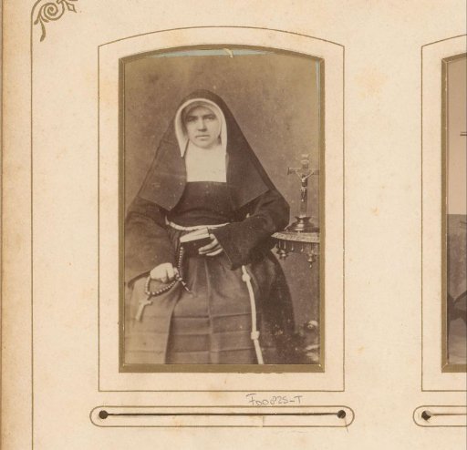 Portrait of a seated nun with a Bible and rosary in her hand