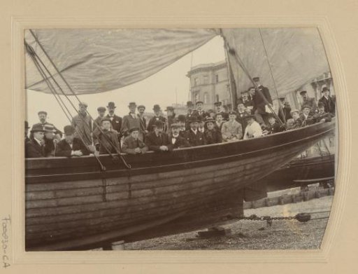 Group portrait by a boat