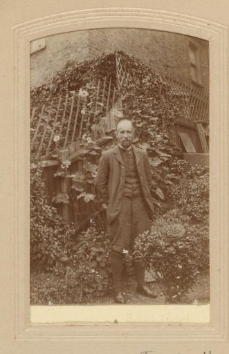 Portrait of a standing man in a garden
